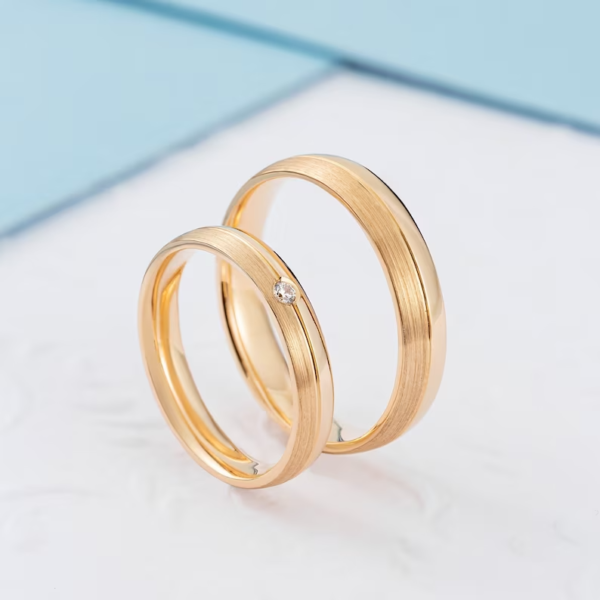 Classic gold wedding bands with diamond in her ring. - Image 4